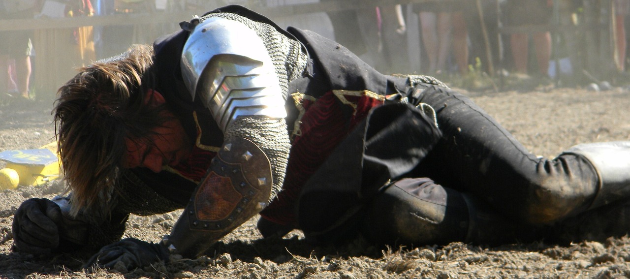 soldier lying on ground, exhausted